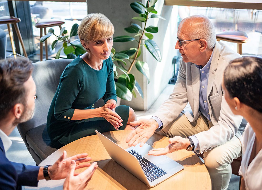 About Our Agency - Group of Business Professionals Sit Together to Have a Small Meeting